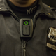 New York City Police Officer Joshua Jones demonstrates how to use and operate a body camera on Dec. 3, 2014. (Andrew Burton/Getty Images)